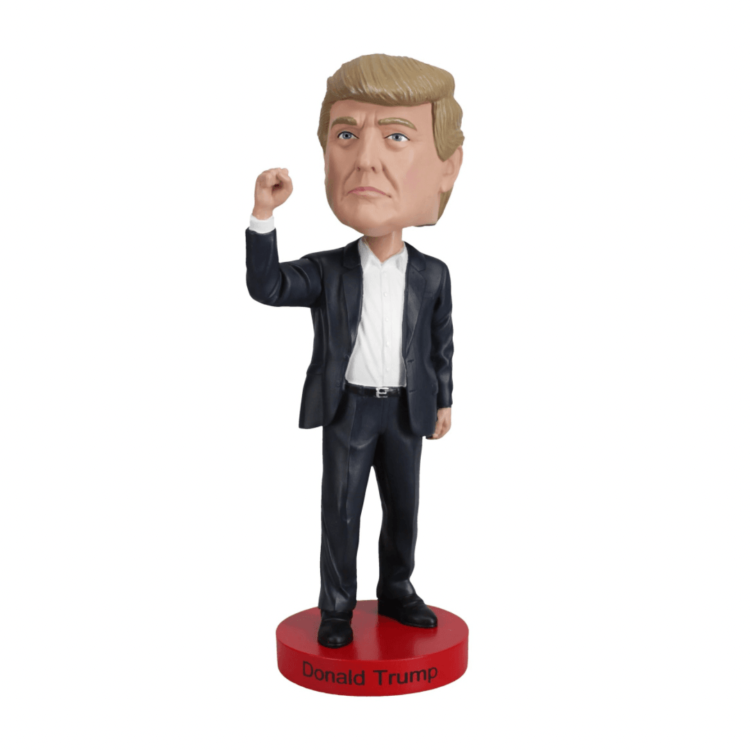 Miniatura bobblehead de Donald Trump em traje social sobre base vermelha